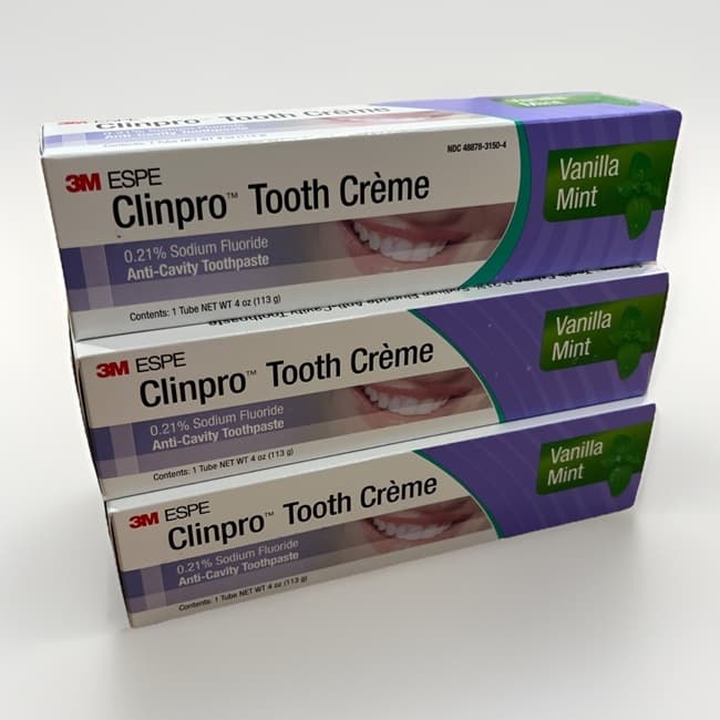 Three stacked boxes of 3M ESPE Clinpro Tooth Creme 113g, vanilla mint