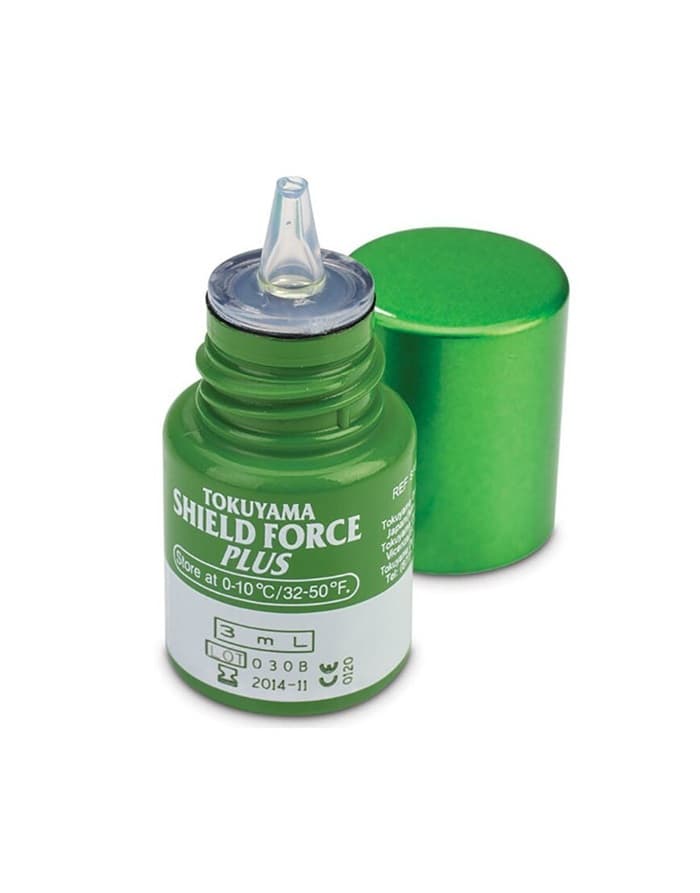 Tokuyama Shield Force Plus dental desensitizer 3mL bottle close-up – green bottle with dropper tip open, green metallic cap removed – label shows Store at 0-10 degrees C 32-50 degrees F, 3mL, CE 0120 marked – dental protective sealant by Tokuyama Dental Japan
