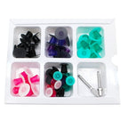 Shofu Super-Snap Mini-Kit dental polishing discs and mandrels scattered view – color-coded snap-on dental polishing discs in black coarse, purple medium, teal fine, pink superfine, green, and white – 2 CA mandrels 0439 – for dental composite resin finishing and polishing worldwide
